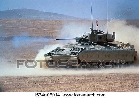 M-2 Bradley Infantry Fighting Vehicle fires its M-242 25mm Gun in the desert View Large Photo Image Picture - M-2 Bradley Infantry Fighting Vehicle fires its M-242 25mm Gun in the desert. Fotosearch