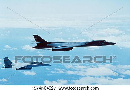 Side profile of a B-1B Lancer with another aircraft in flight View Large Photo Image Stock Photo - Side profile of a B-1B Lancer with another aircraft in flight. Fotosearch