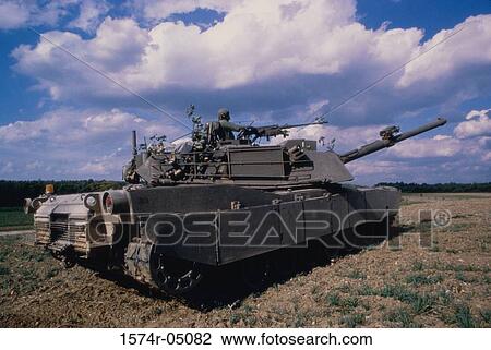 Soldier in an M-1 tank in the desert View Large Photo Image Stock Image - Soldier in an M-1 tank in the desert. Fotosearch