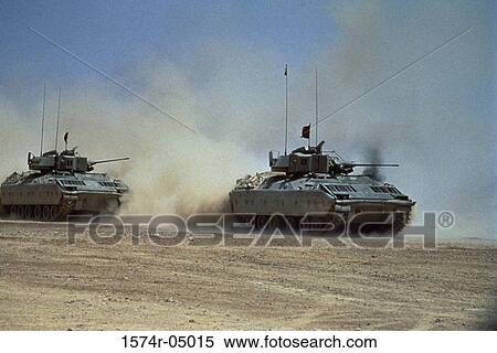 Stock Photography - Two M-1 Abram tanks in the desert. Fotosearch
