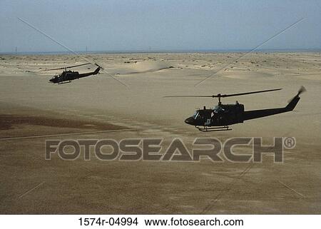 UH-1N Iroquois helicopter and AH-1Sea Cobra helicopter in flight View Large Photo Image Picture - UH-1N Iroquois helicopter and AH-1Sea Cobra helicopter in flight. Fotosearch