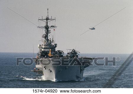USS Tripoli sailing in the sea View Large Photo Image Stock Image - USS Tripoli sailing in the sea. Fotosearch