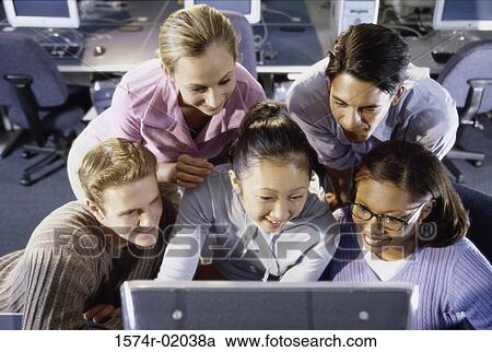 Group of people in front of a computer monitor View Large Photo Image Stock Image - Group of people in front of a computer monitor. Fotosearch