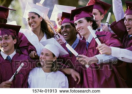 Group of teenagers holding their degrees on graduation day View Large Photo Image Stock Image - Group of teenagers holding their degrees on graduation day. Fotosearch
