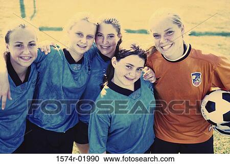 Stock Image - Portrait of a group of teenage girls in a soccer team. Fotosearch