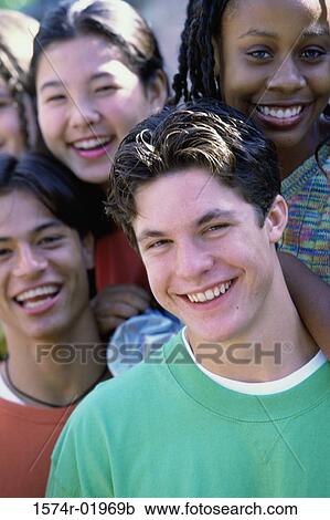 Stock Image - Portrait of a group of teenagers posing. Fotosearch