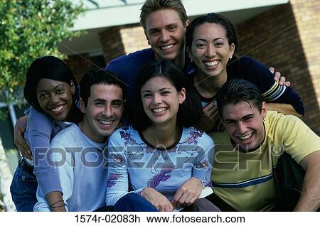 Stock Image - Portrait of a group of teenagers smiling. Fotosearch
