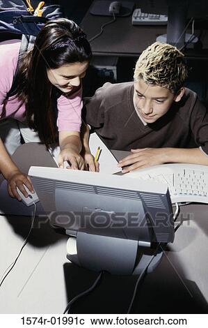 Teenage boy and a teenage girl in front of a computer monitor View Large Photo Image Stock Image - Teenage boy and a teenage girl in front of a computer monitor. Fotosearch