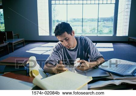 Teenage boy reading a book View Large Photo Image Stock Image - Teenage boy reading a book. Fotosearch