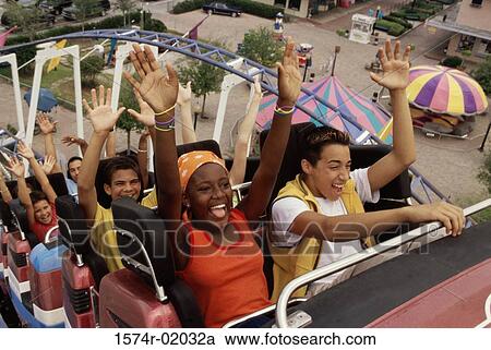 Teenage boys and girls on a roller coaster ride View Large Photo Image Stock Image - Teenage boys and girls on a roller coaster ride. Fotosearch