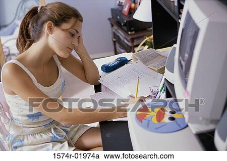Teenage girl writing with a pencil View Large Photo Image Stock Image - Teenage girl writing with a pencil. Fotosearch