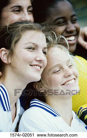 Stock Image - Teenage girls smiling. Fotosearch