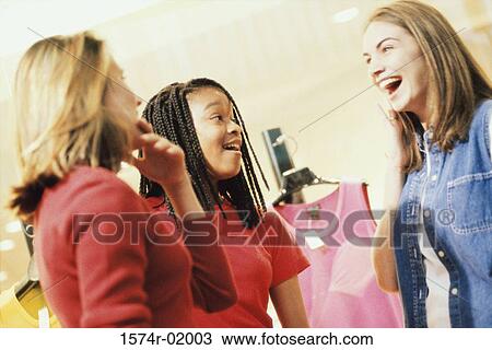 Three teenage girls talking to each other View Large Photo Image Stock Image - Three teenage girls talking to each other. Fotosearch