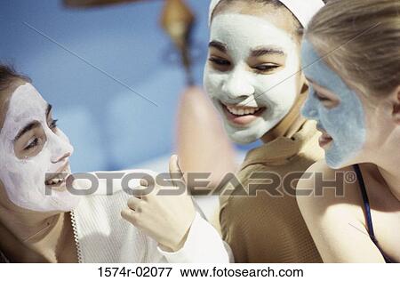 Three teenage girls wearing facial masks View Large Photo Image Stock Photo - Three teenage girls wearing facial masks. Fotosearch