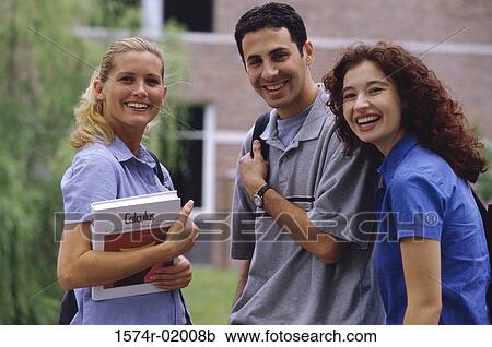 Three teenage students talking outdoors View Large Photo Image Stock Image - Three teenage students talking outdoors. Fotosearch