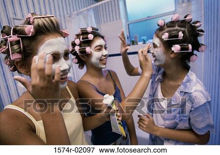 Three teenager girls applying facial masks View Large Photo Image Stock Photo - Three teenager girls applying facial masks. Fotosearch