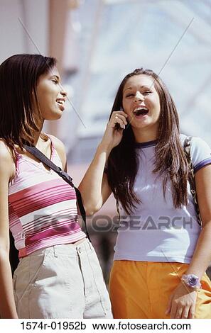 Two teenage girls laughing View Large Photo Image Stock Image - Two teenage girls laughing. Fotosearch