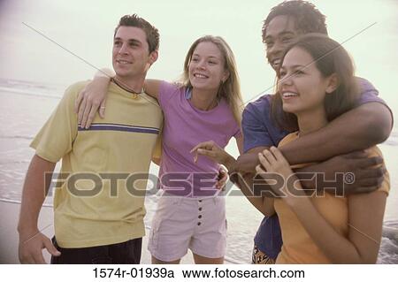 Two teenager couples at the beach View Large Photo Image Stock Image - Two teenager couples at the beach. Fotosearch