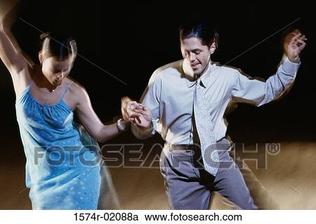 Young couple dancing together View Large Photo Image Stock Image - Young couple dancing together. Fotosearch
