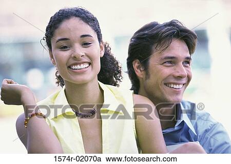Young couple smiling View Large Photo Image Stock Image - Young couple smiling. Fotosearch