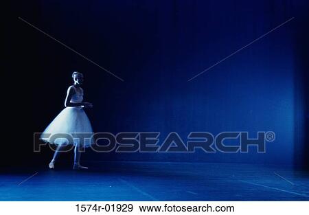 Young woman standing on a stage in a tutu View Large Photo Image Stock Photo - Young woman standing on a stage in a tutu. Fotosearch