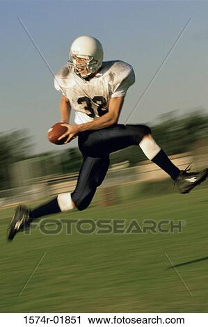 American football player running on a field View Large Photo Image Stock Image - American football player running on a field. Fotosearch
