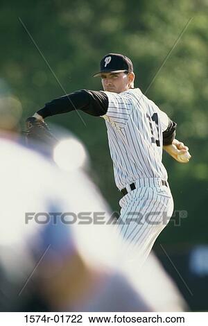 Stock Image - Baseball player throwing a pitch. Fotosearch