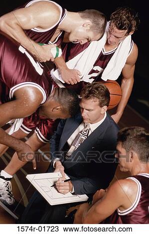 Stock Image - Basketball players and their couch. Fotosearch