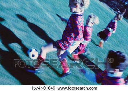 Children playing soccer View Large Photo Image Stock Photo - Children playing soccer. Fotosearch