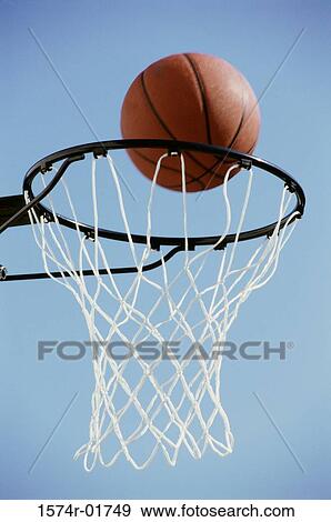 Close-up of a basketball on the edge of a hoop View Large Photo Image Stock Photo - Close-up of a basketball on the edge of a hoop. Fotosearch