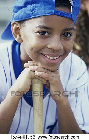 Stock Image - Close-up of a boy from a little league baseball team. Fotosearch