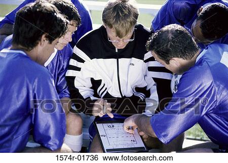 Coach with a soccer team View Large Photo Image Stock Photograph - Coach with a soccer team. Fotosearch