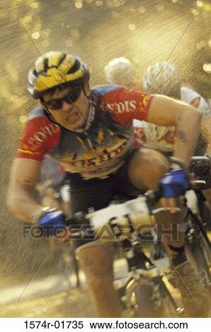 Cyclists racing in the rain View Large Photo Image Stock Photography - Cyclists racing in the rain. Fotosearch