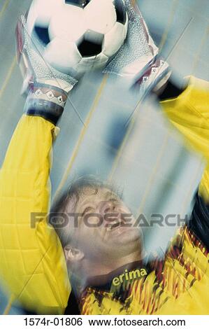 Stock Photograph - Goalie saving a ball. Fotosearch