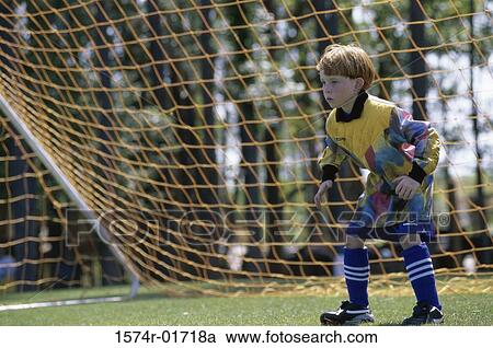 Stock Image - Goalie standing in the goal. Fotosearch
