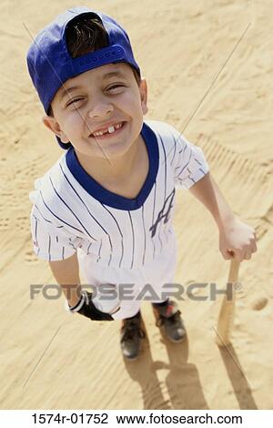High angle view of a boy from a little league baseball team View Large Photo Image Stock Image - High angle view of a boy from a little league baseball team. Fotosearch