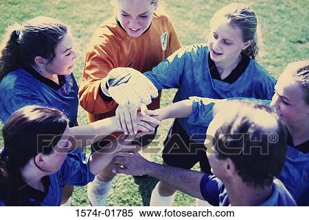 High angle view of a girl's soccer team in a huddle View Large Photo Image Stock Photography - High angle view of a girl's soccer team in a huddle. Fotosearch