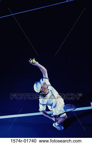 High angle view of a man playing tennis View Large Photo Image Stock Image - High angle view of a man playing tennis. Fotosearch