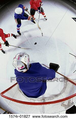 High angle view of ice hockey players surrounding the goal View Large Photo Image Stock Photo - High angle view of ice hockey players surrounding the goal. Fotosearch
