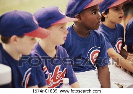Stock Photo - Little league baseball team sitting together. Fotosearch