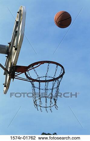 Low angle view of a basketball bouncing off the hoop View Large Photo Image Stock Image - Low angle view of a basketball bouncing off the hoop. Fotosearch