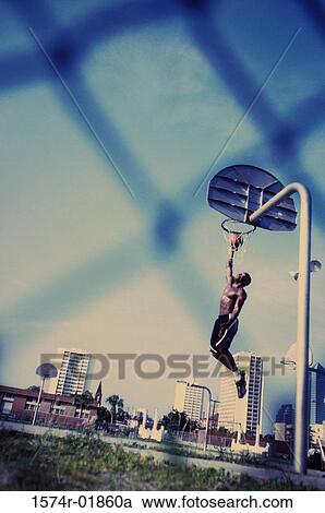 Man playing basketball View Large Photo Image Stock Image - Man playing basketball. Fotosearch