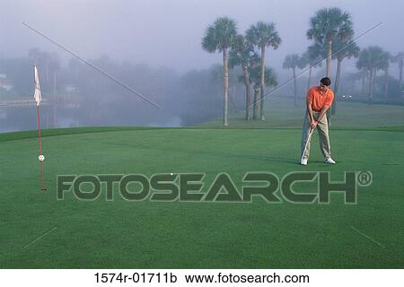 Stock Image - One man playing golf. Fotosearch