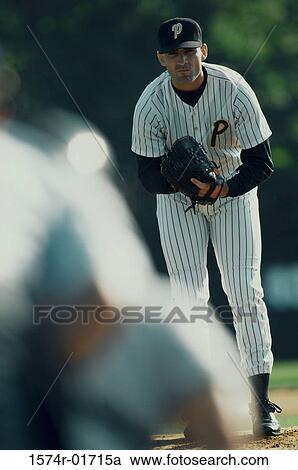 Portrait of a baseball pitcher bending forward View Large Photo Image Stock Image - Portrait of a baseball pitcher bending forward. Fotosearch