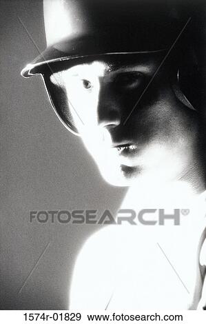 Stock Photo - Portrait of a baseball player. Fotosearch