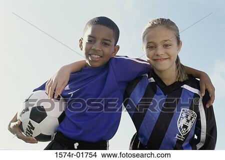 Portrait of a boy and girl from a soccer team View Large Photo Image Picture - Portrait of a boy and girl from a soccer team. Fotosearch