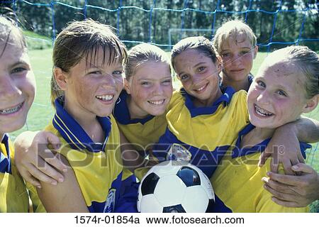 Stock Image - Portrait of a smiling girls soccer team. Fotosearch