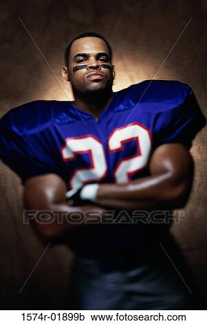 Stock Image - Portrait of an American football player. Fotosearch