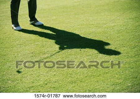 Stock Photo - Shadow of a person playing golf. Fotosearch