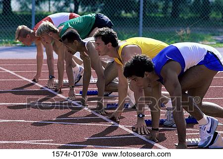 Side profile of male runners at the starting line View Large Photo Image Stock Image - Side profile of male runners at the starting line. Fotosearch